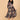 Woman twirling in The Mom Store Muted Muse maternity dress featuring vibrant patch-print design.
