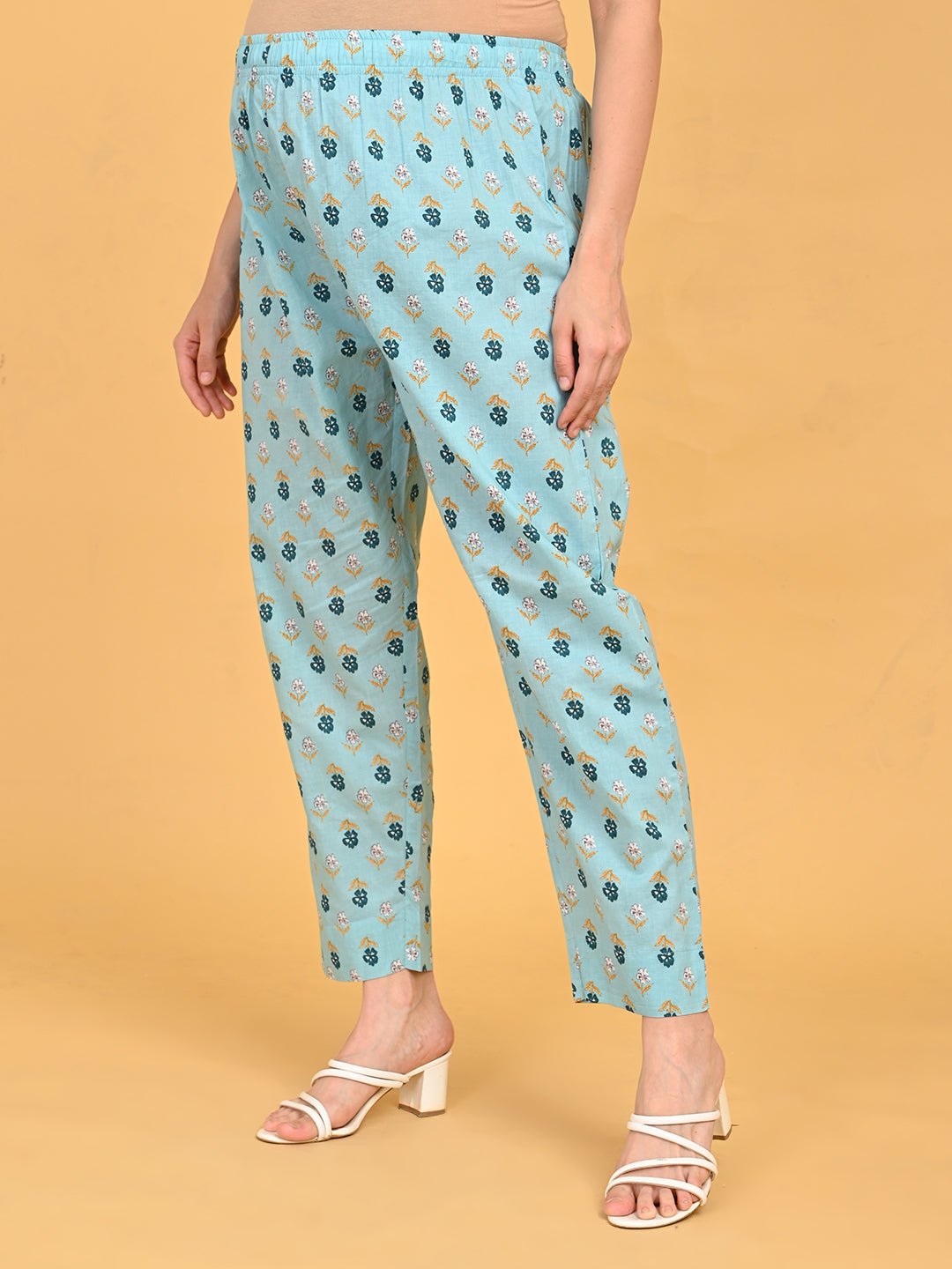 Blue printed maternity straight pants with elasticated waistband for pregnancy comfort.