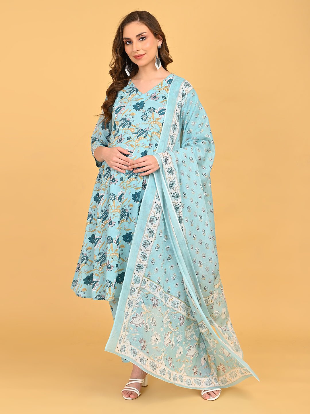 Model wearing Neelam Saaz blue floral maternity and nursing kurta set with straight pants.