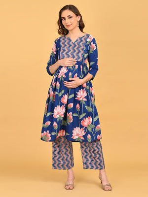 Model posing in NeelVaani Maternity Kurta Set displaying floral print, three-quarter sleeves and matching printed pants.