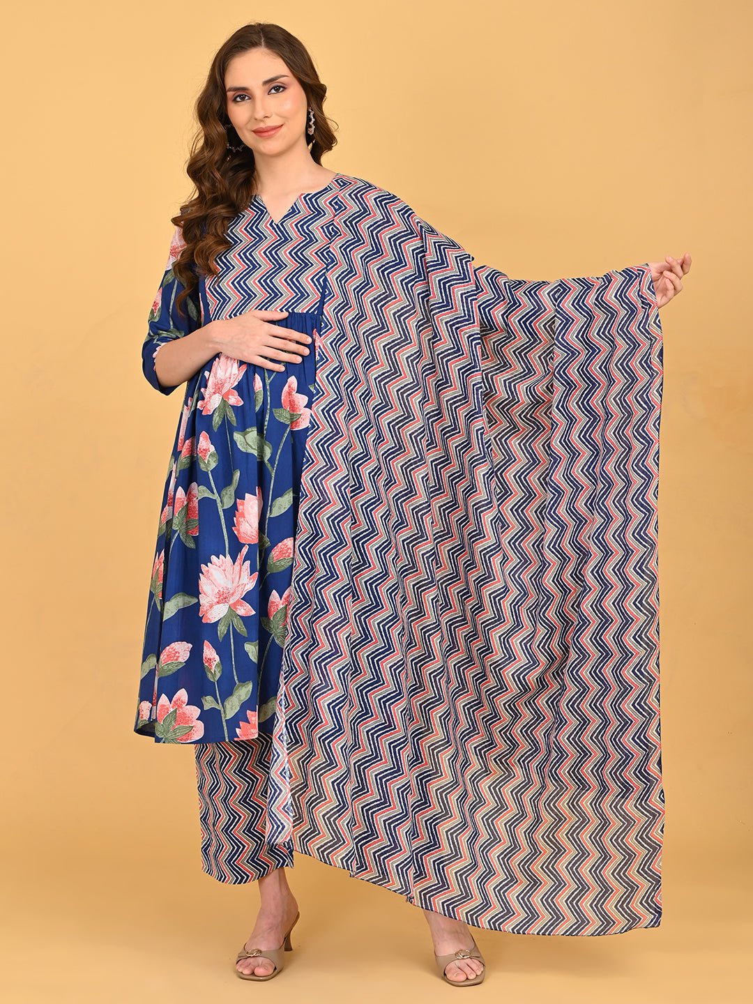 Model wearing NeelVaani Maternity and Nursing Kurta Set With Dupatta featuring blue floral kurta, zigzag printed dupatta and matching straight pants.