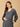 The Mom Store maternity sweater dress with delicate lace neckline and cuff detailing for a chic winter look.