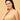 Side profile of Model wearing beige coloured non-padded nursing and feeding bra from the mom store