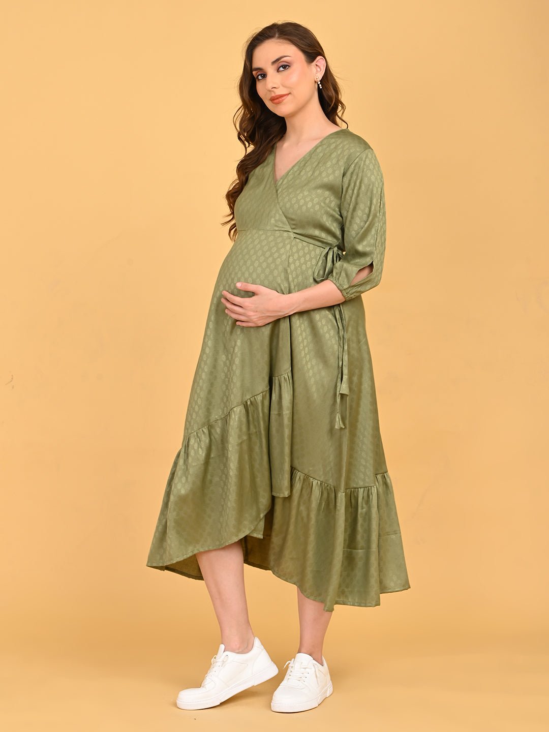 Olivious Maternity Wrap Dress angled full-length view showcasing layered asymmetrical hem and casual styling.