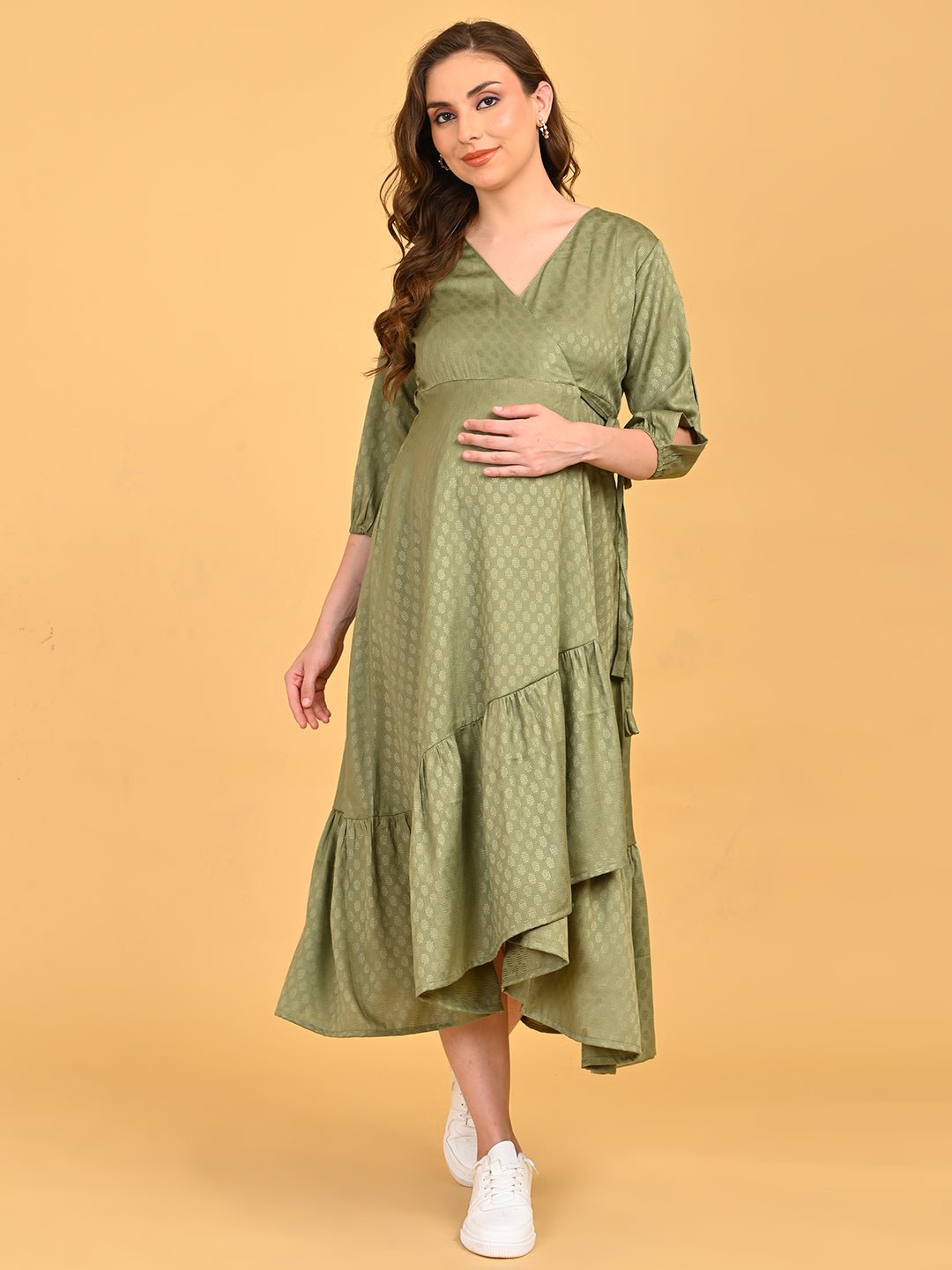 Olivious Maternity Wrap Dress front view with hands on baby bump, emphasizing flattering wrap design.