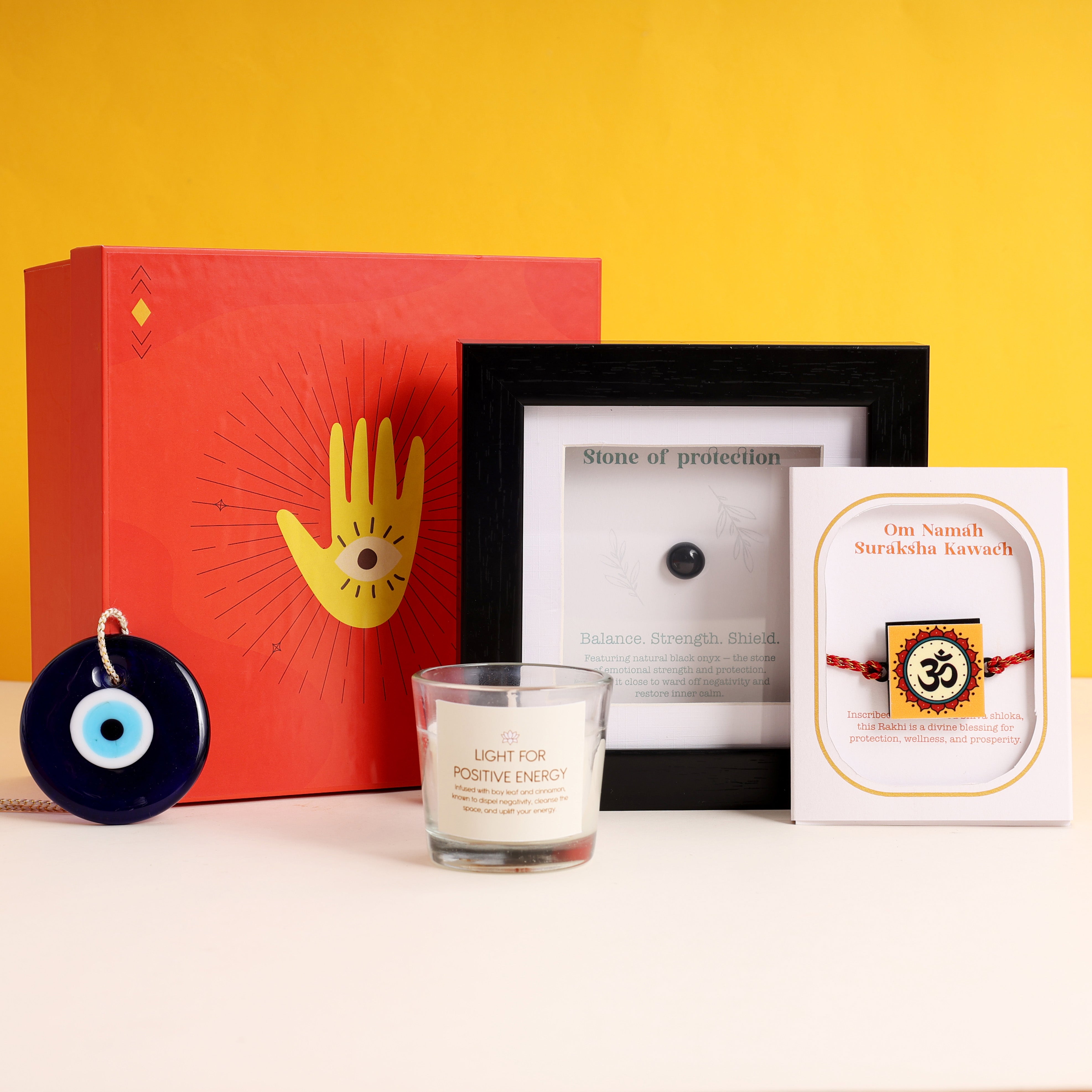 Oye Happy Evil Eye Rakhi Hamper – Om Rakhi, Negativity Shield Frame, Spiritual Candle & Charm | Rakhi Gift for Brother, Bhai & Bhaiya - OHEERH
