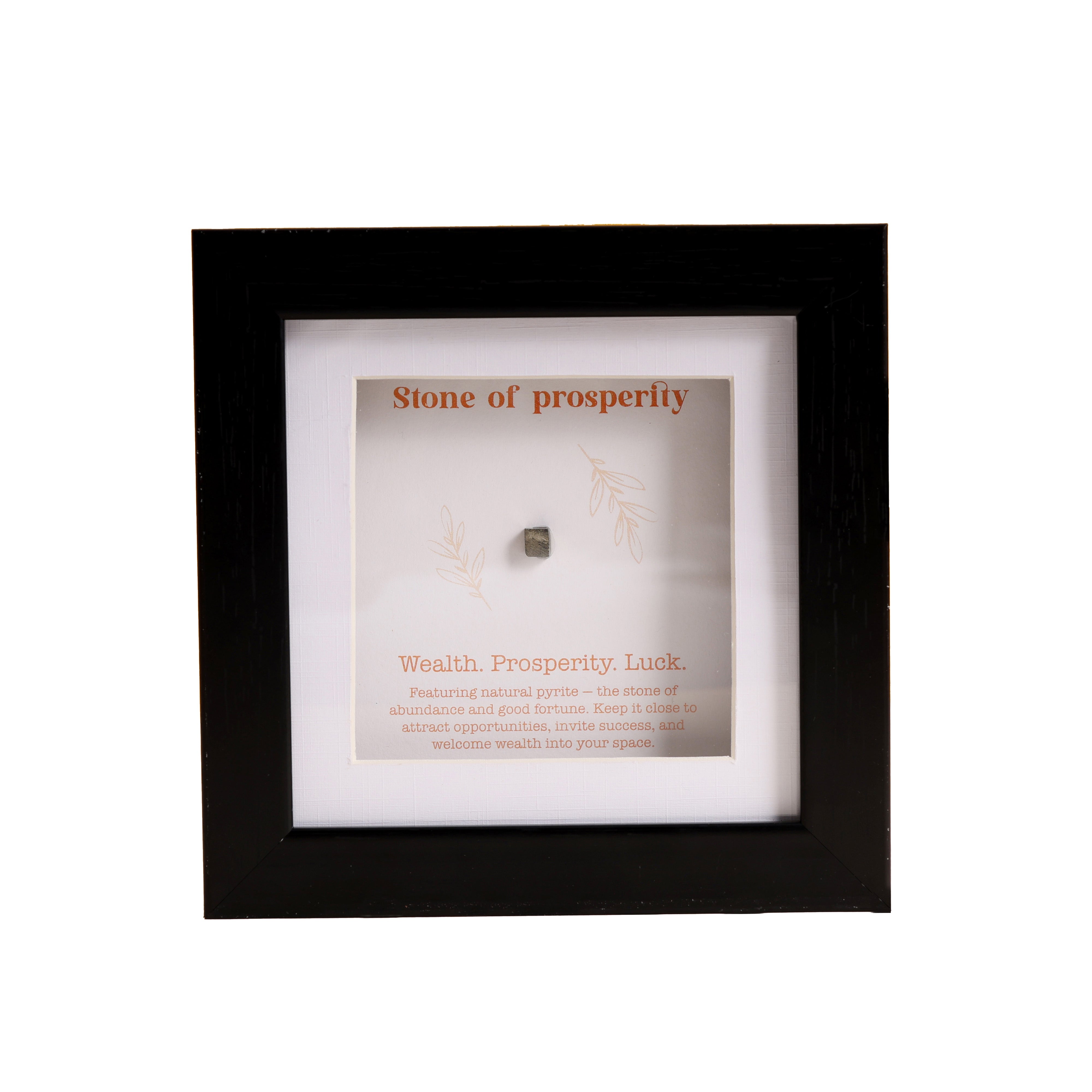 Framed stone labeled 'Stone of Prosperity' with text on a white background