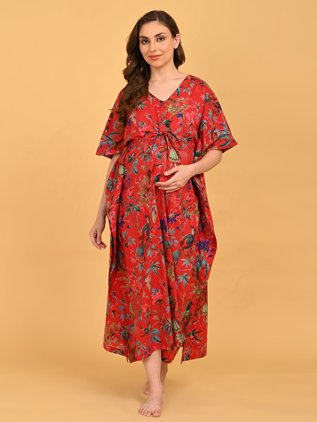 Painted Breeze Maternity and Nursing Kaftan Nighty full-length front view showcasing vibrant red floral and bird print with relaxed kaftan silhouette.