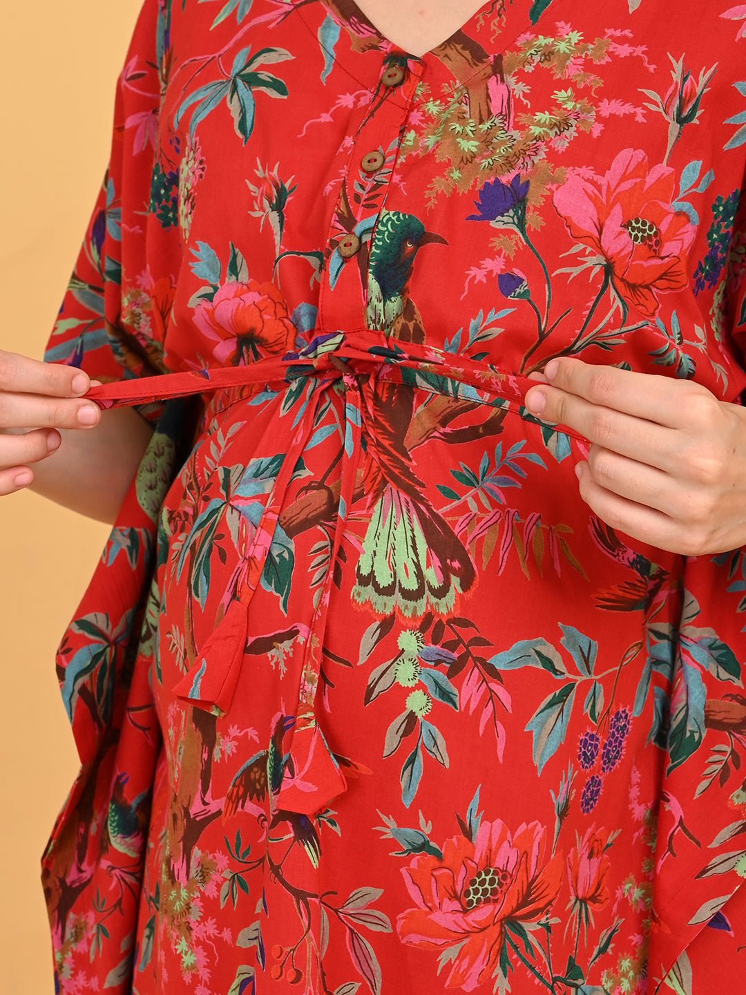 Painted Breeze Maternity and Nursing Kaftan Nighty close-up of adjustable waist tie being fastened for a comfortable fit.