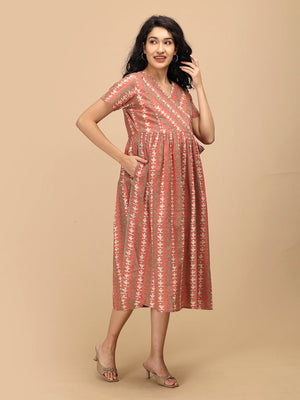 Peach Mirage Maternity and Nursing Dress ‚Äì angled front view of maternity dress.