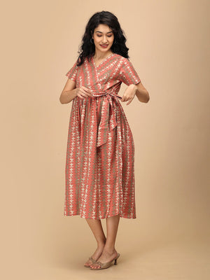 Peach Mirage Maternity and Nursing Dress ‚Äì model wearing peach printed dress with waist tie, front view