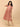Peach Mirage Maternity and Nursing Dress ‚Äì model showing nursing access and adjustable side tie detail.