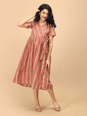 Peach Mirage Maternity and Nursing Dress ‚Äì model showing nursing access and adjustable side tie detail.