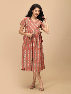 Peach Mirage Maternity and Nursing Dress ‚Äì model in midi dress with side tie, smiling front view.