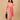 Peach printed maternity and nursing dress styled with a matching shacket and black tote bag for a casual outing look.