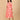 Side view of a peach maternity and nursing shacket dress featuring white leaf prints and a relaxed A-line silhouette.