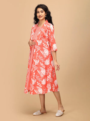 Side view of a peach maternity and nursing shacket dress featuring white leaf prints and a relaxed A-line silhouette.