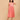 Sleeveless peach maternity and nursing dress with soft gathers under the bust for a comfortable pregnancy fit.
