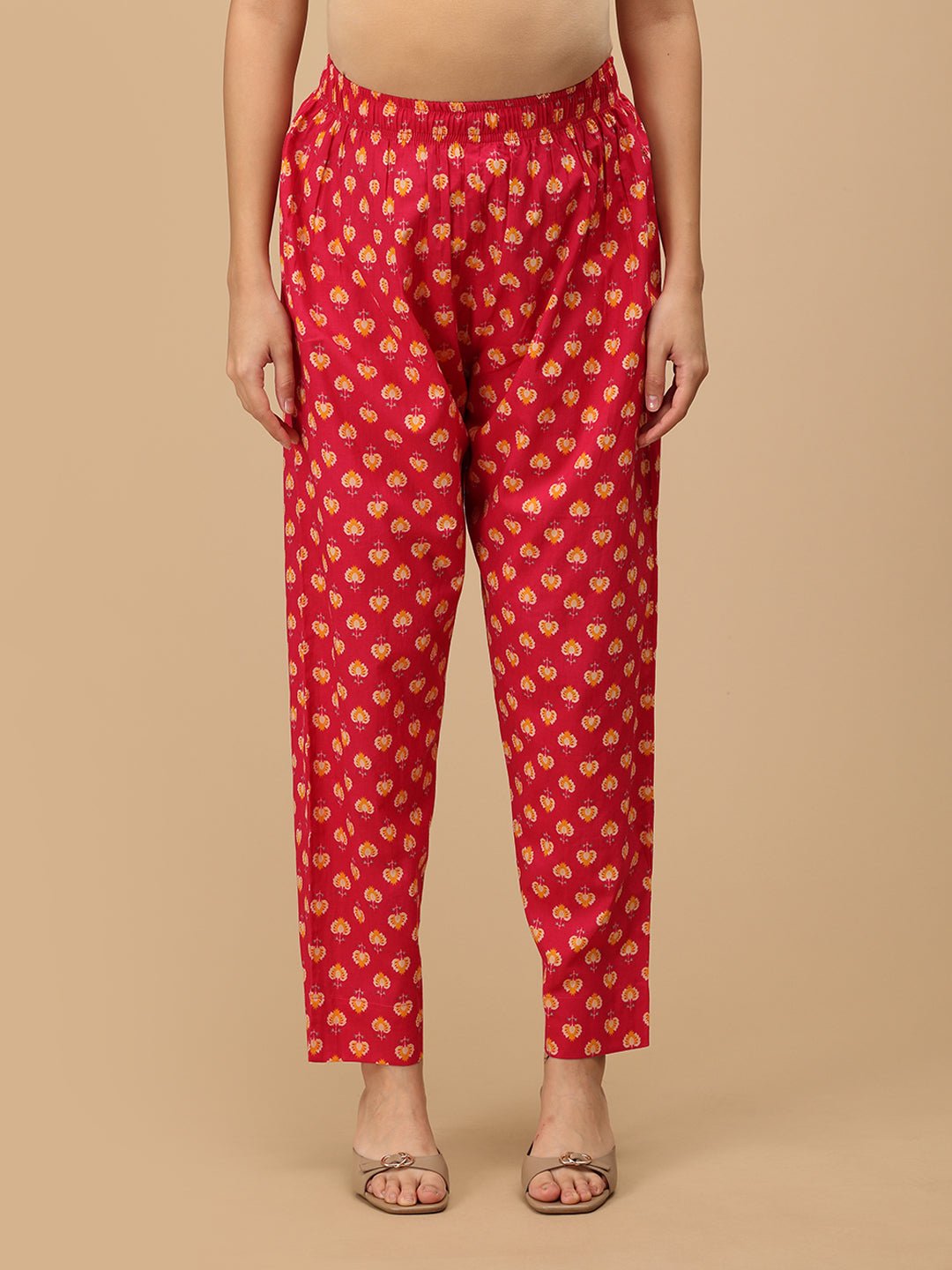 Front view of printed pink straight-fit maternity pants with an elasticated waistband.