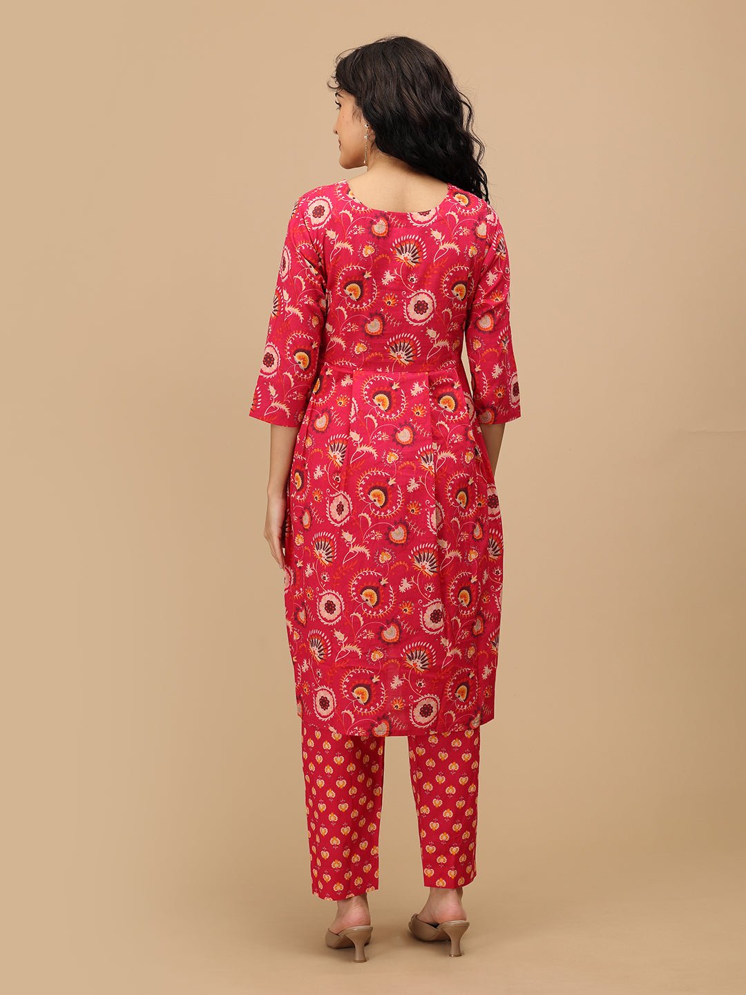 Back view of the printed pink maternity kurta and matching pants showing the straight hemline and three-quarter sleeves.
