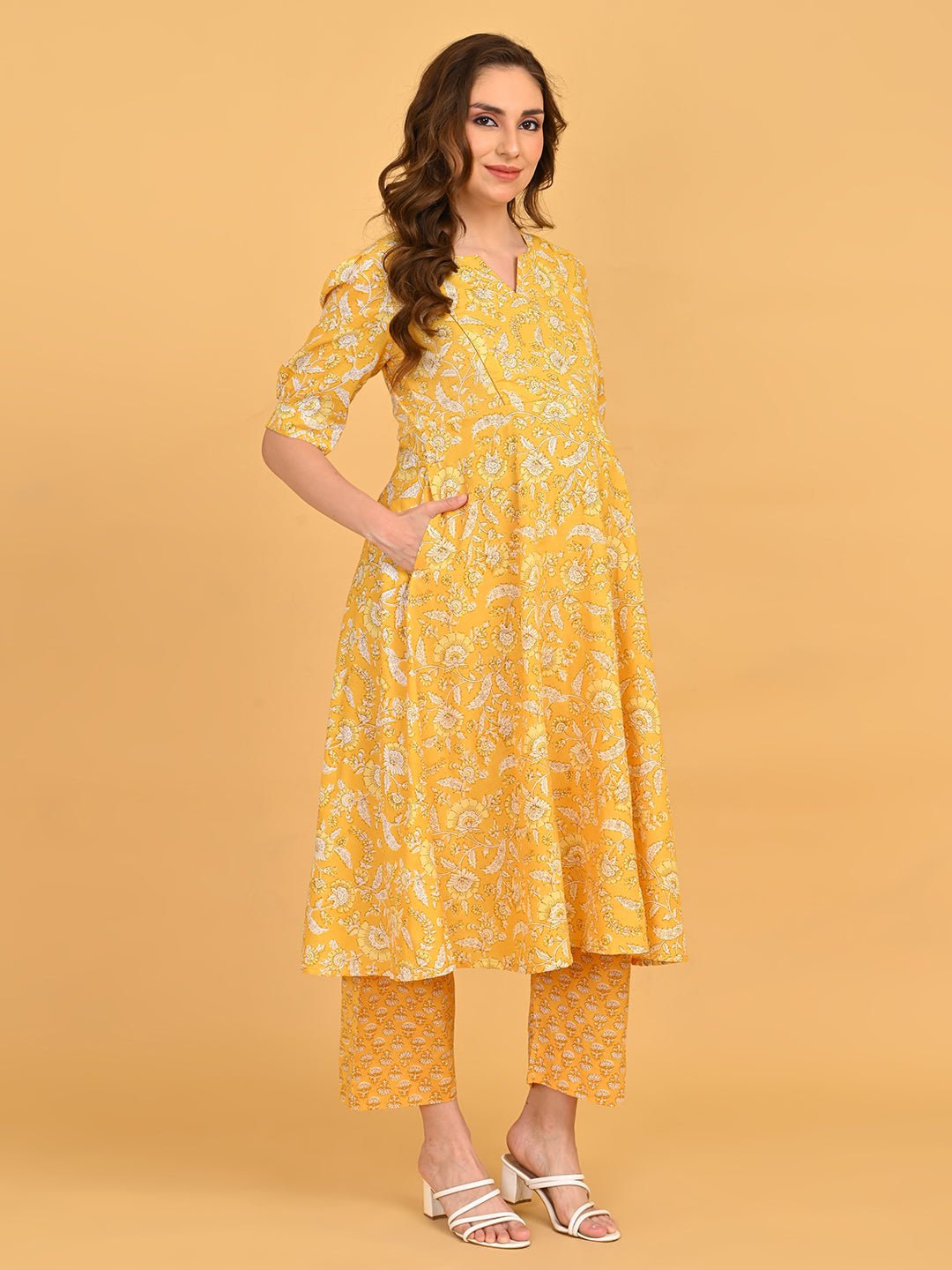 Yellow floral maternity and nursing kurta set showing bump-friendly A-line silhouette.