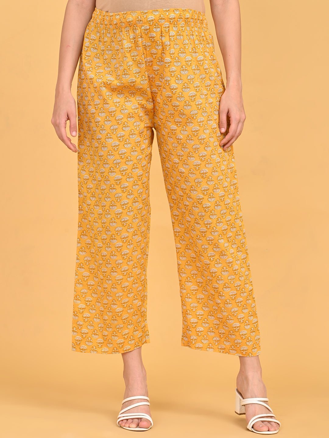 Yellow printed maternity straight pants with elastic waistband for pregnancy comfort.