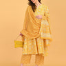 Yellow maternity kurta set styled with matching dupatta and textured yellow clutch for festive wear.
