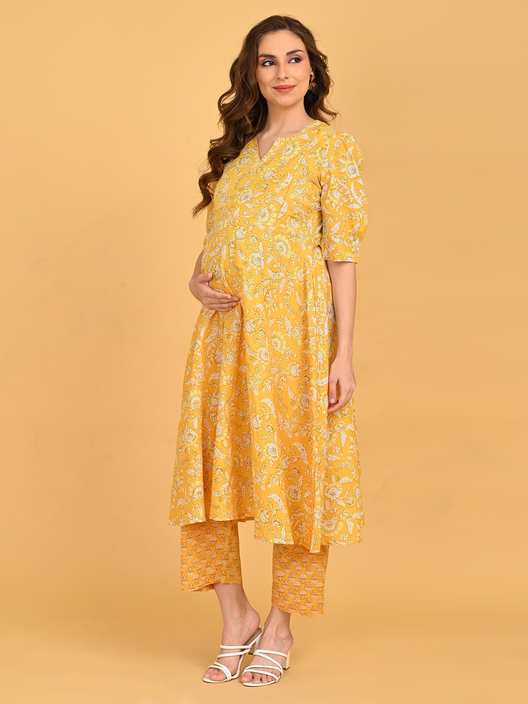 Yellow floral maternity and nursing kurta set showing bump-friendly A-line silhouette.