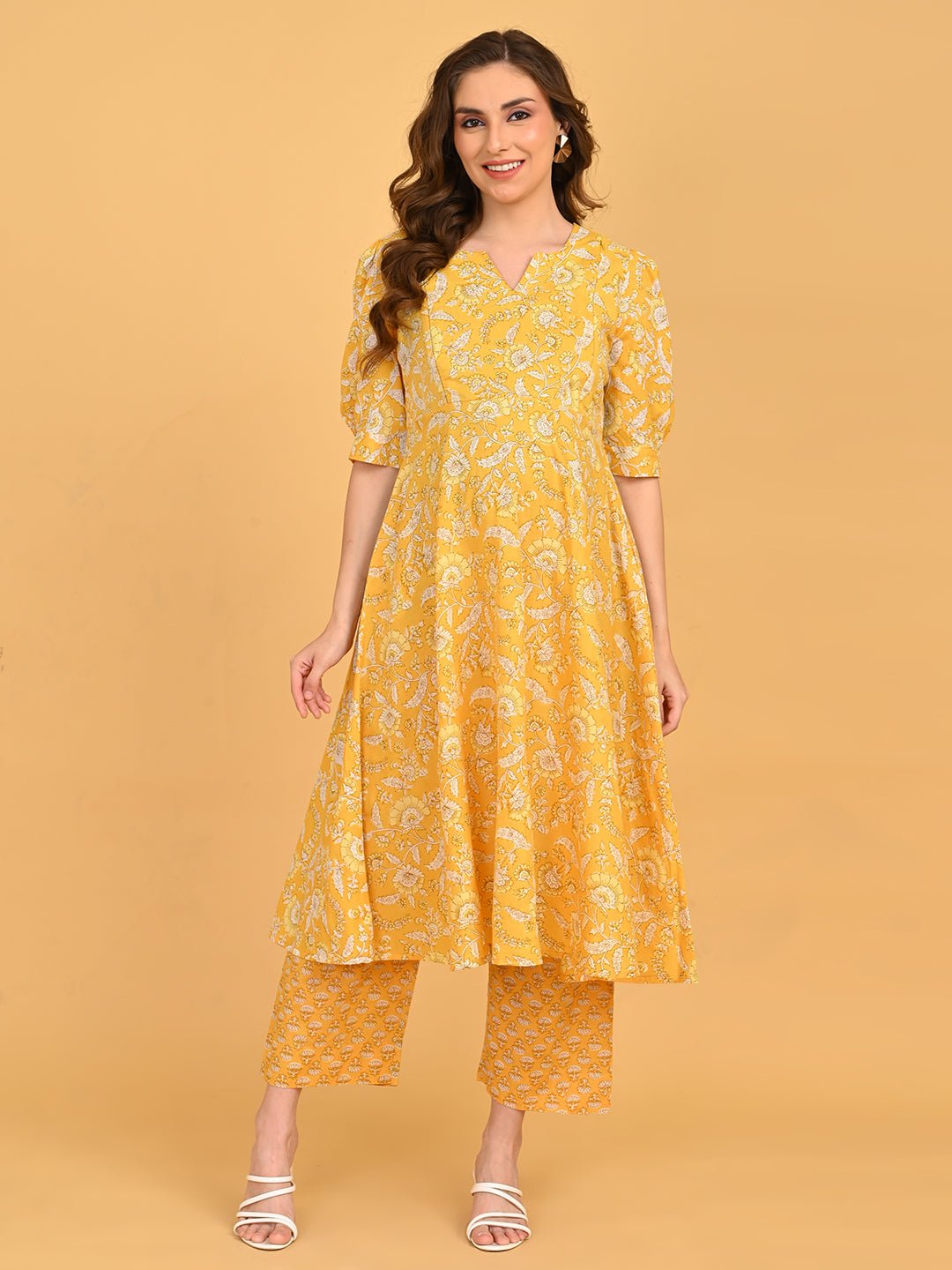 Yellow floral maternity and nursing kurta set showing bump-friendly A-line silhouette.