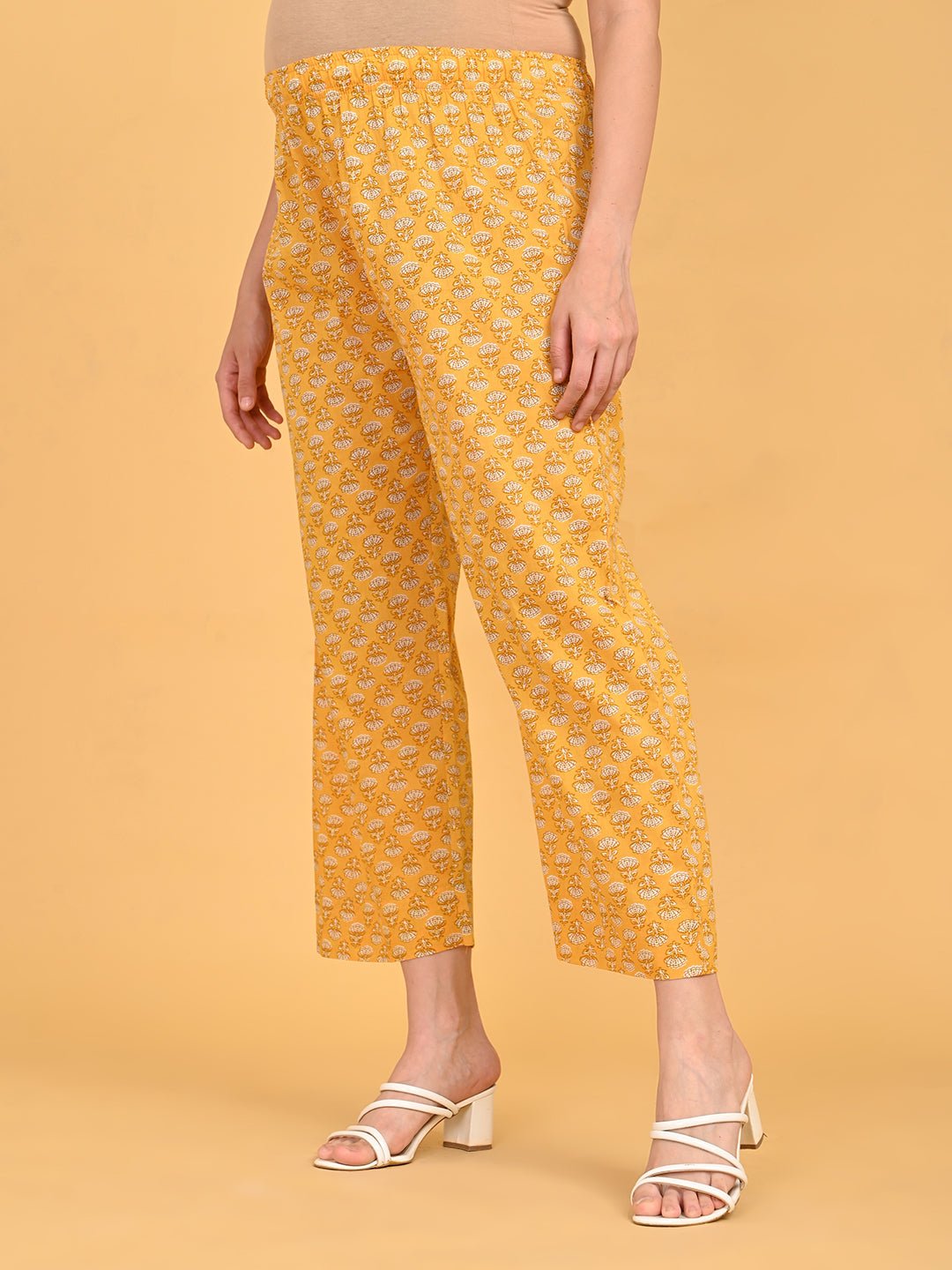 Yellow printed maternity straight pants with elastic waistband for pregnancy comfort.