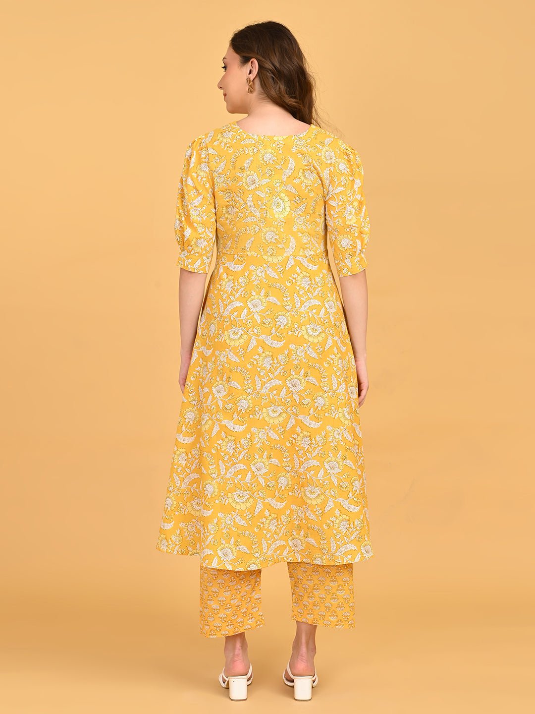 Back view of yellow maternity kurta set.