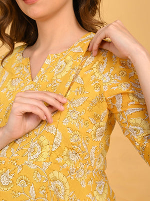 Hidden vertical nursing zipper on yellow floral maternity kurta for discreet breastfeeding access.