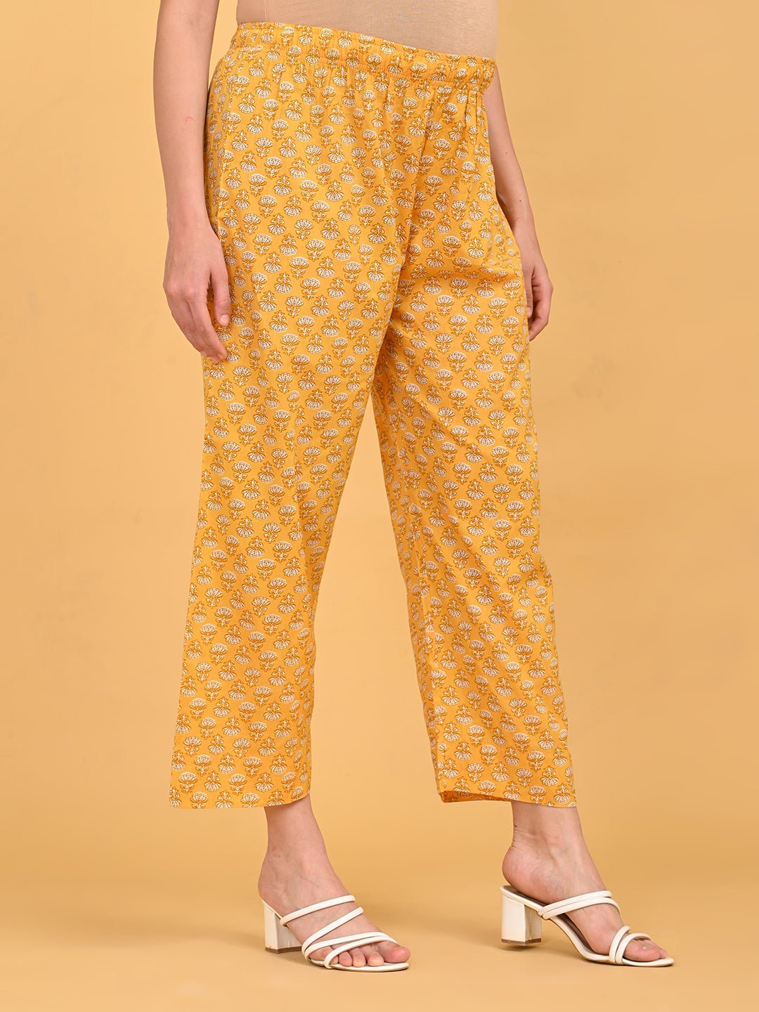 Yellow printed maternity straight pants with elastic waistband for pregnancy comfort.