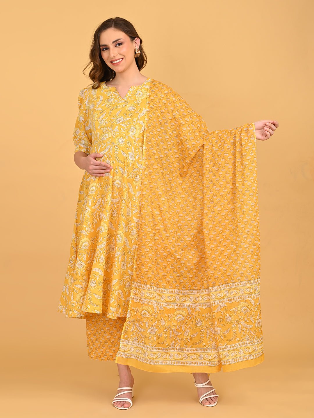 Front portrait of yellow floral maternity kurta highlighting V-notch neckline and soft puff sleeves.