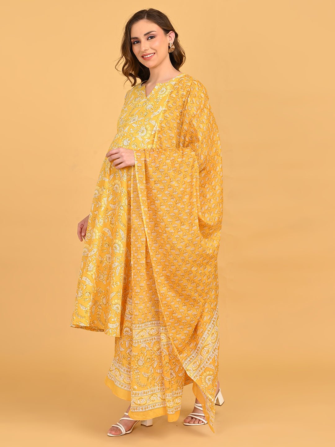 Front portrait of yellow floral maternity kurta highlighting V-notch neckline and soft puff sleeves.