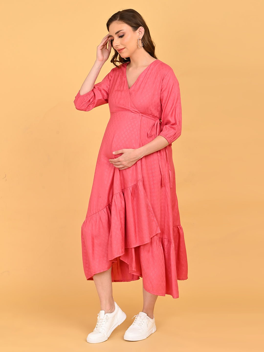 Pink to the Future Maternity Wrap Dress side profile view highlighting the flattering wrap fit and soft drape over the bump.