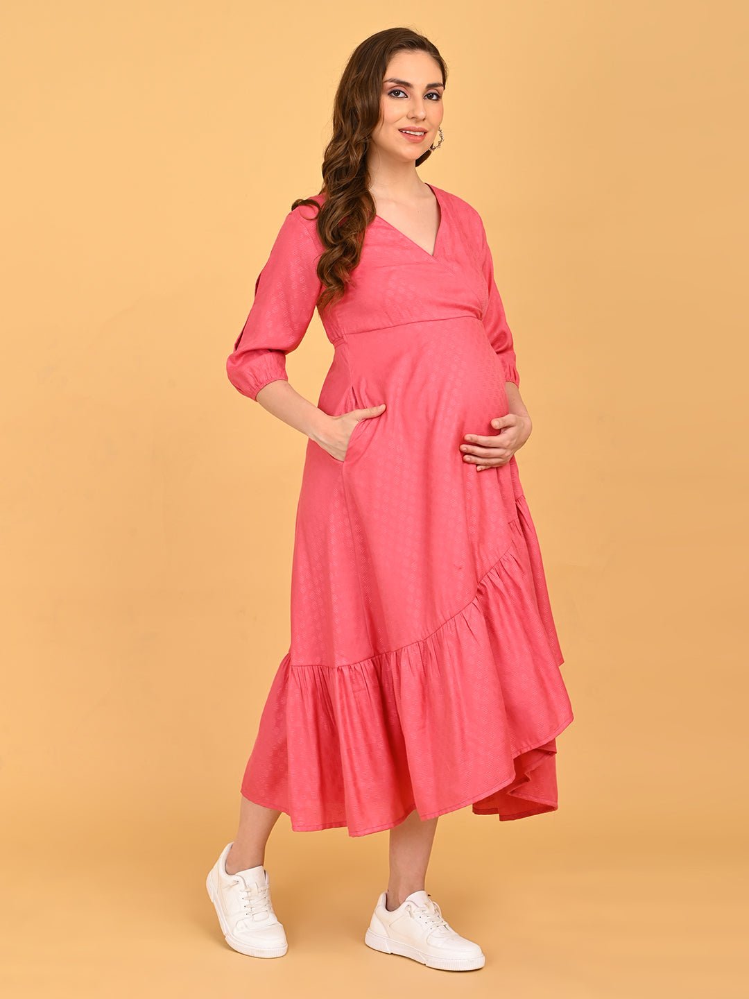Pink to the Future Maternity Wrap Dress three-quarter front pose highlighting textured fabric and comfortable fit.