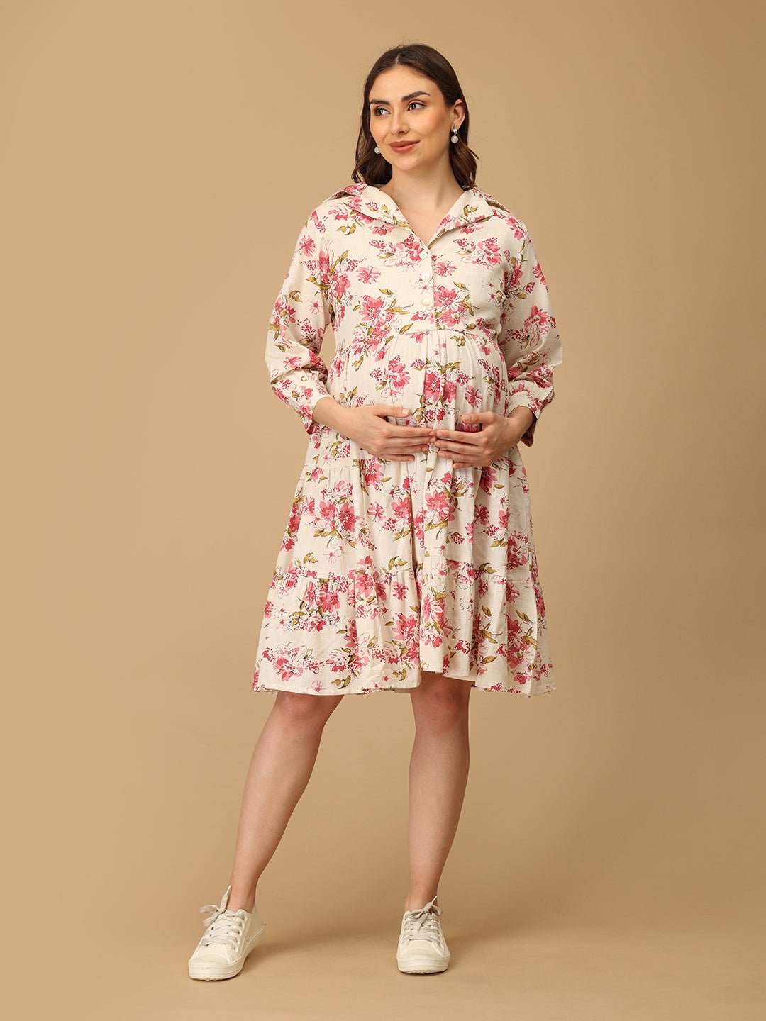 Woman wearing a floral dress on a beige background