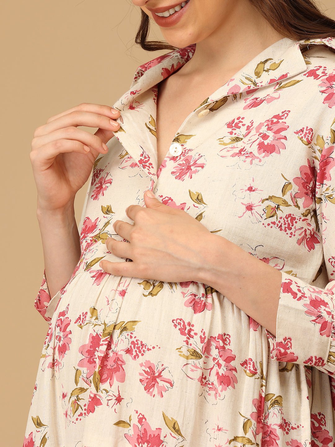 Woman wearing a floral dress with a beige background