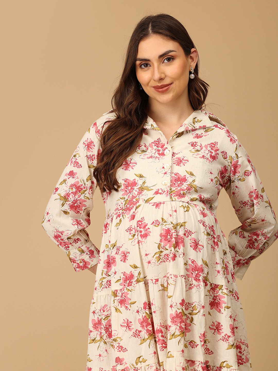 Woman wearing a floral dress against a beige background