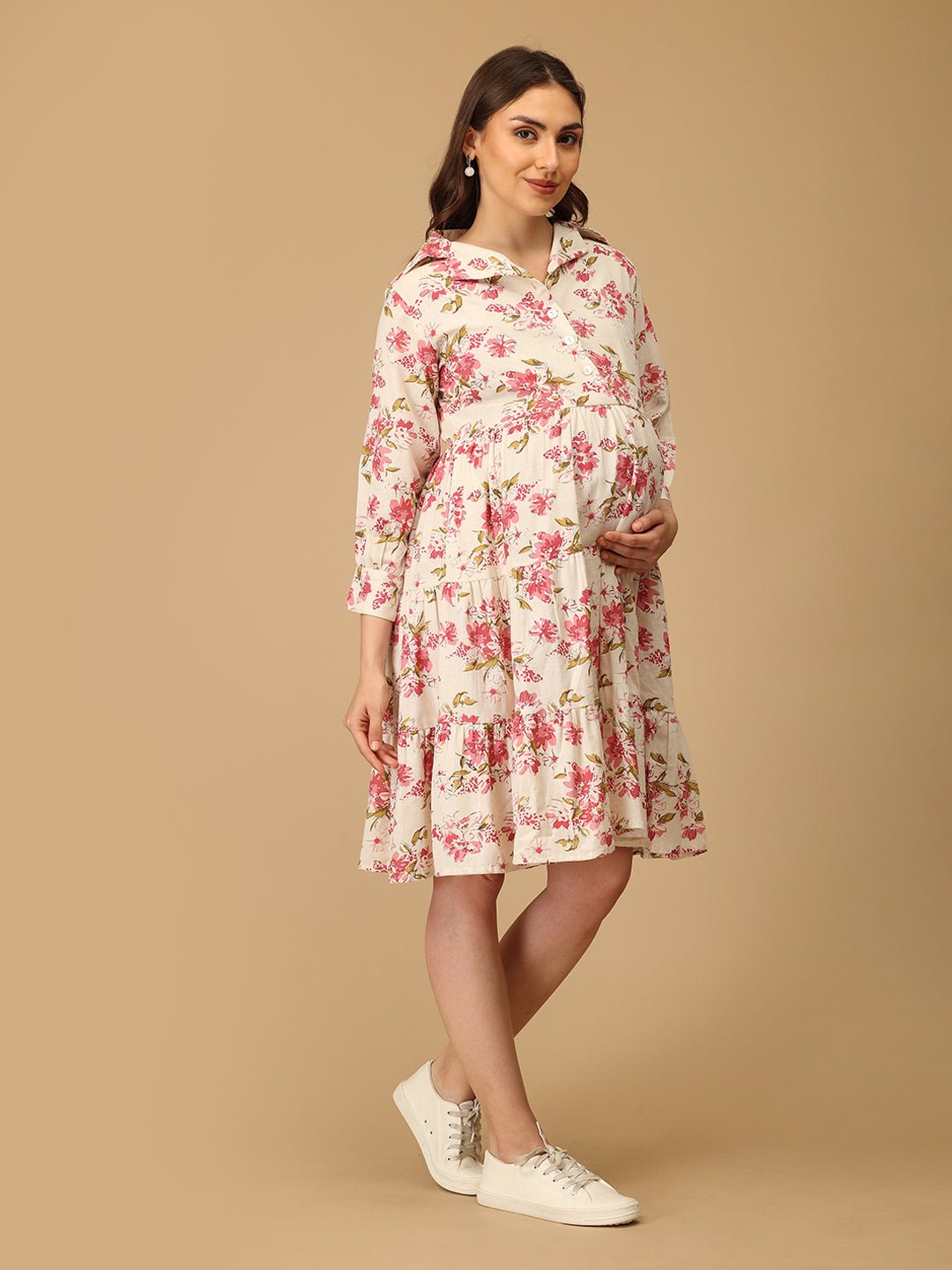 Woman wearing a floral dress on a beige background