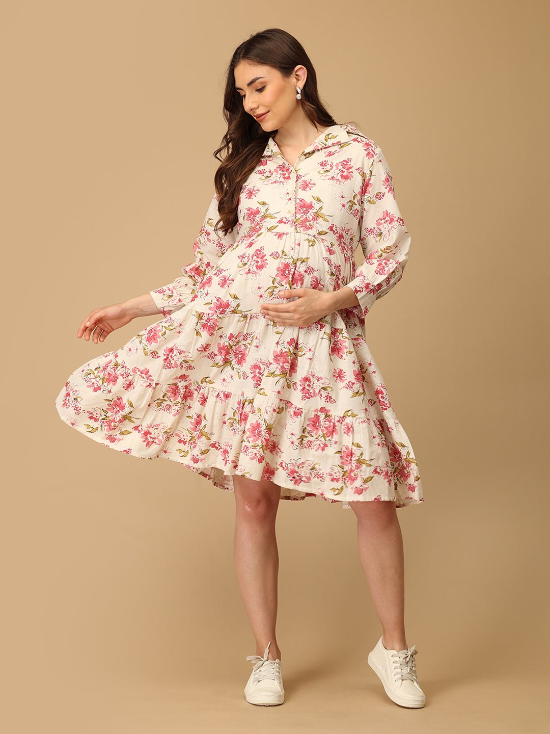 Woman wearing a floral dress on a beige background
