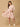Woman wearing a floral dress on a beige background