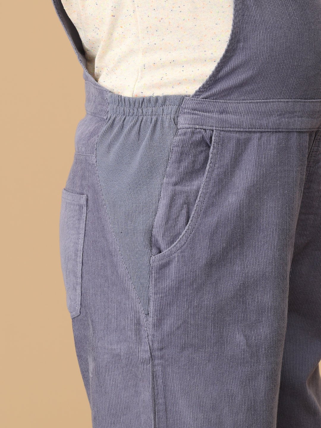 Elastic expandable side panel detail on The Mom Store powder blue maternity dungaree for belly comfort.