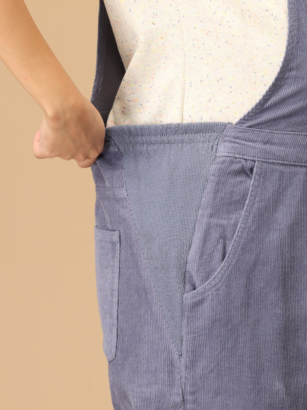 Close-up of stretchable side panel on The Mom Store powder blue corduroy maternity dungaree.