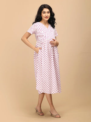 Purple Dot Maternity and Nursing Dress ‚Äì full-length front view of a white polka dot maternity dress with flared silhouette.