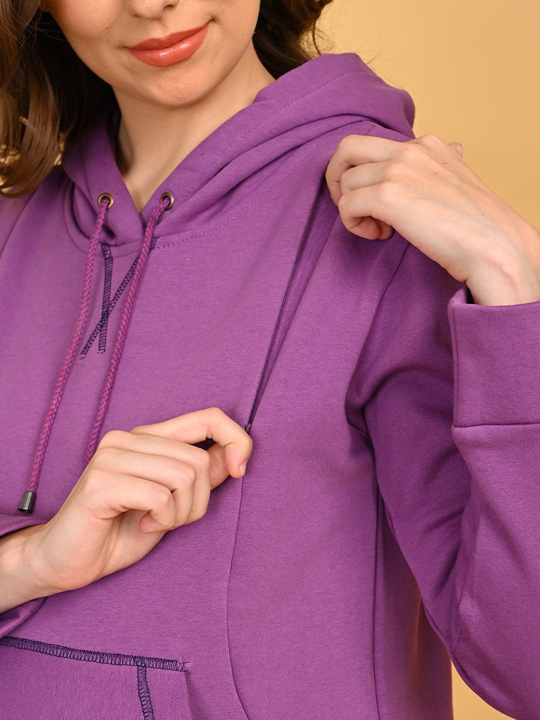 Close-up of hidden side zipper on Purple Frostbite maternity hoodie for easy nursing access.