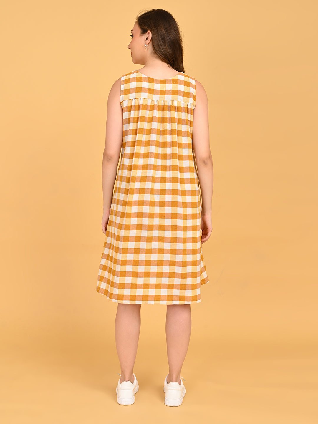 Quiet Grid Maternity and Nursing Shacket Dress back view of sleeveless yellow check maternity dress showing relaxed gathered back fit.
