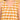 Quiet Grid Maternity and Nursing Shacket Dress close-up of V-neckline and pleated front detail in yellow check fabric.