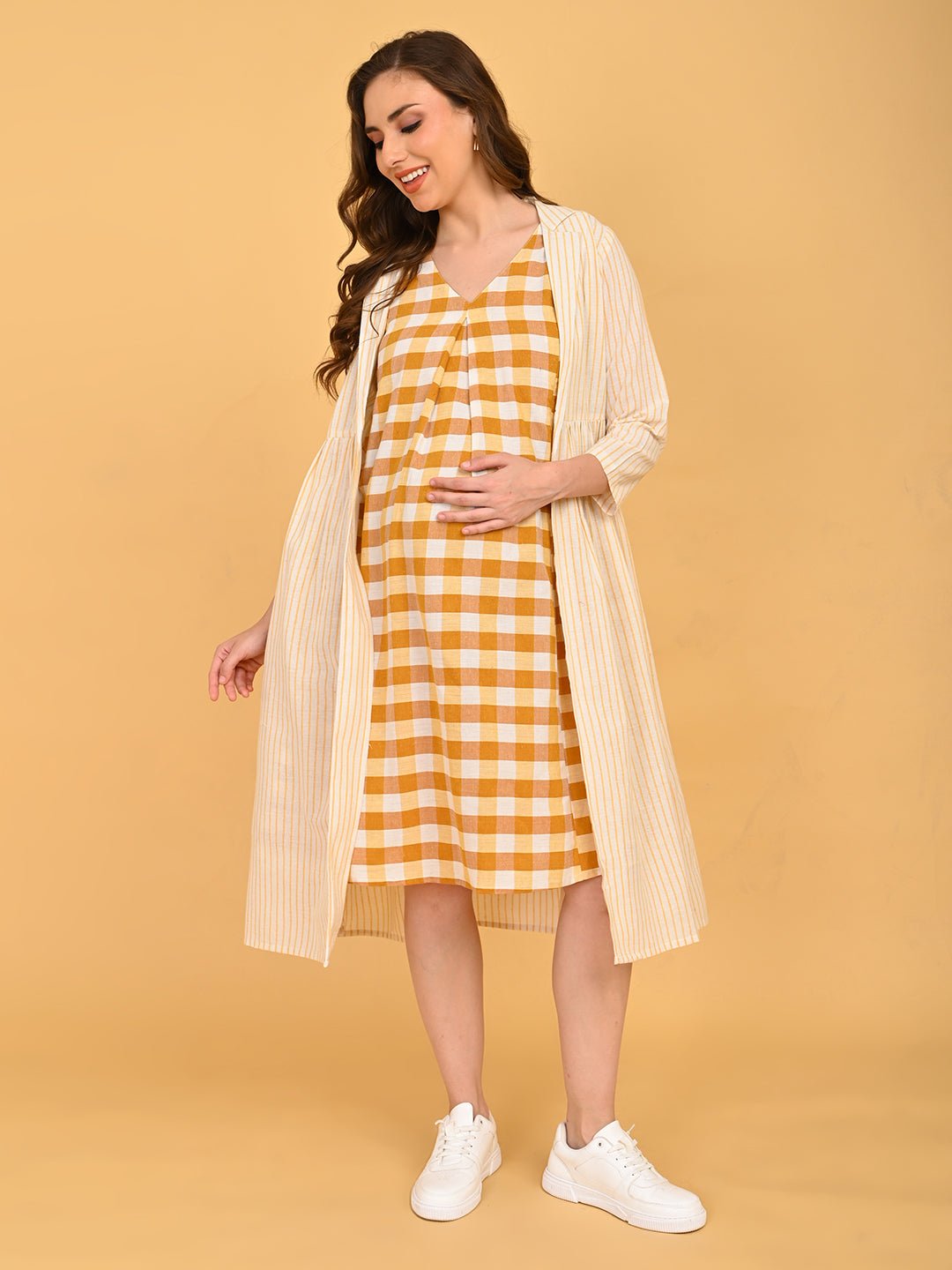 Quiet Grid Maternity and Nursing Shacket Dress walking pose highlighting layered maternity dress and striped shacket.